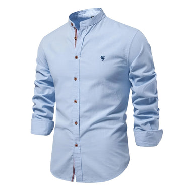 Light blue shirt with rolled-up sleeves on a white background